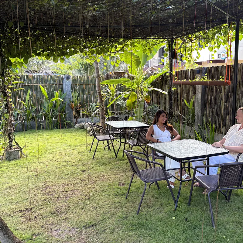 Tables set out under the garden pergola