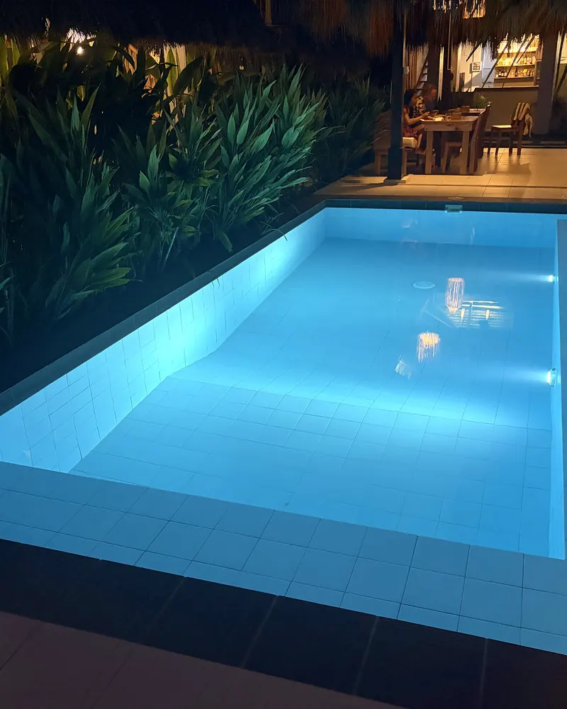 The pool lit up at night